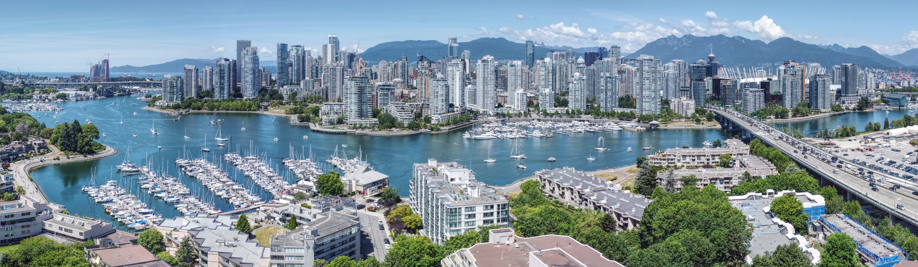 Vancouver skyline with mountains in the background and water in the foreground